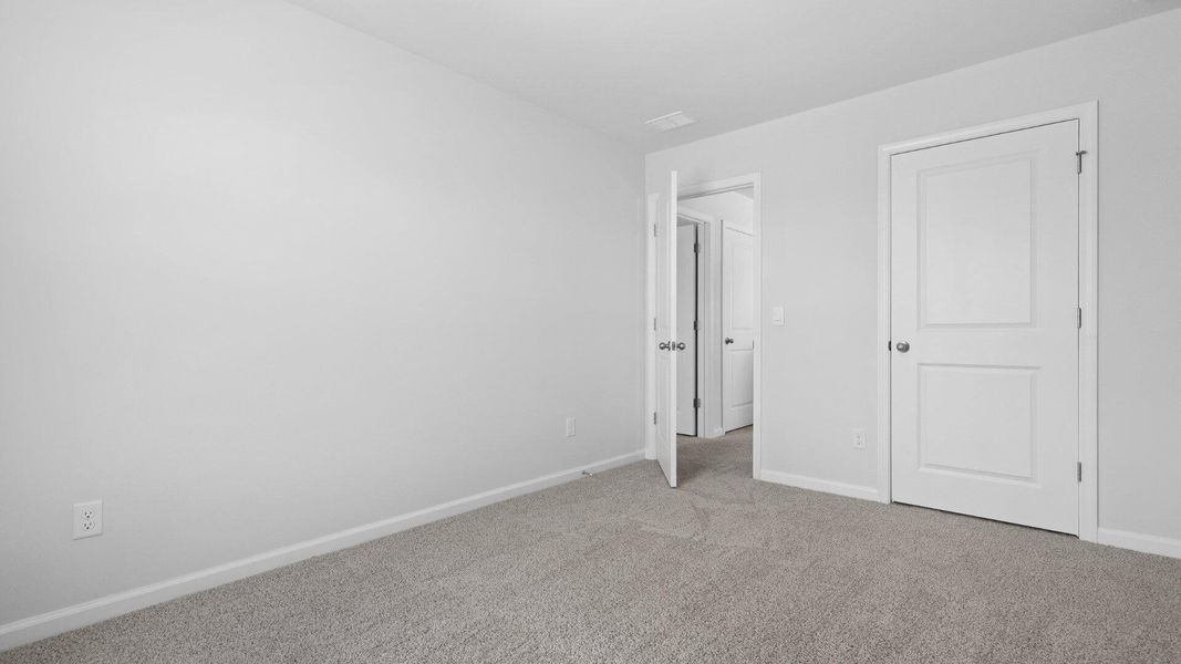 Spacious, unfurnished interior of a new home in Pine Hills at Cane Bay, Summerville (Image 9).