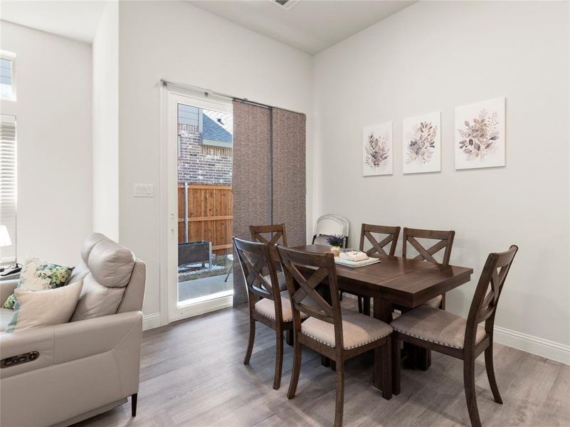 Dining space featuring baseboards and wood finished floors