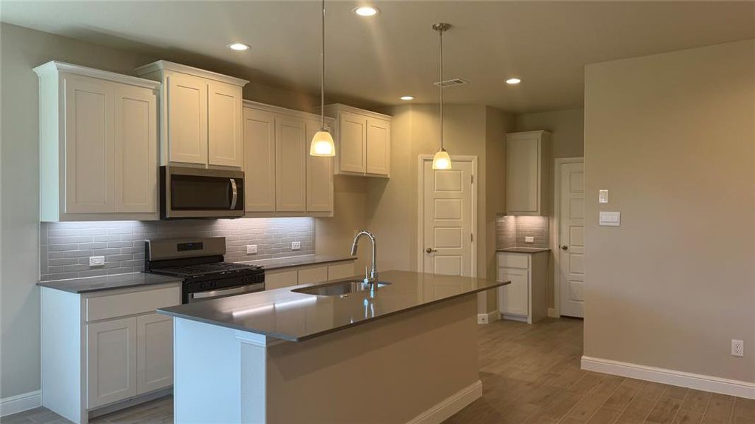 Kitchen - All Home and community information, including pricing, included features, terms, availability and amenities, are subject to change at any time without notice or obligation. All Drawings, pictures, photographs, video, square footages, floor plans, elevations, features, colors and sizes are approximate for illustration purposes only and will vary from the homes as built.