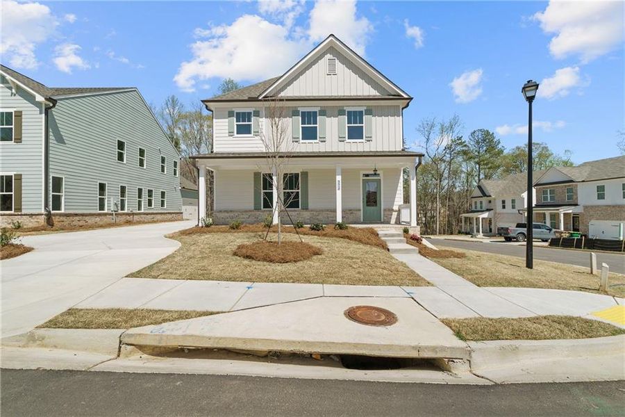 Front exterior of a new home in Edenglen, Buford, GA, highlighting curb appeal (Image 1).