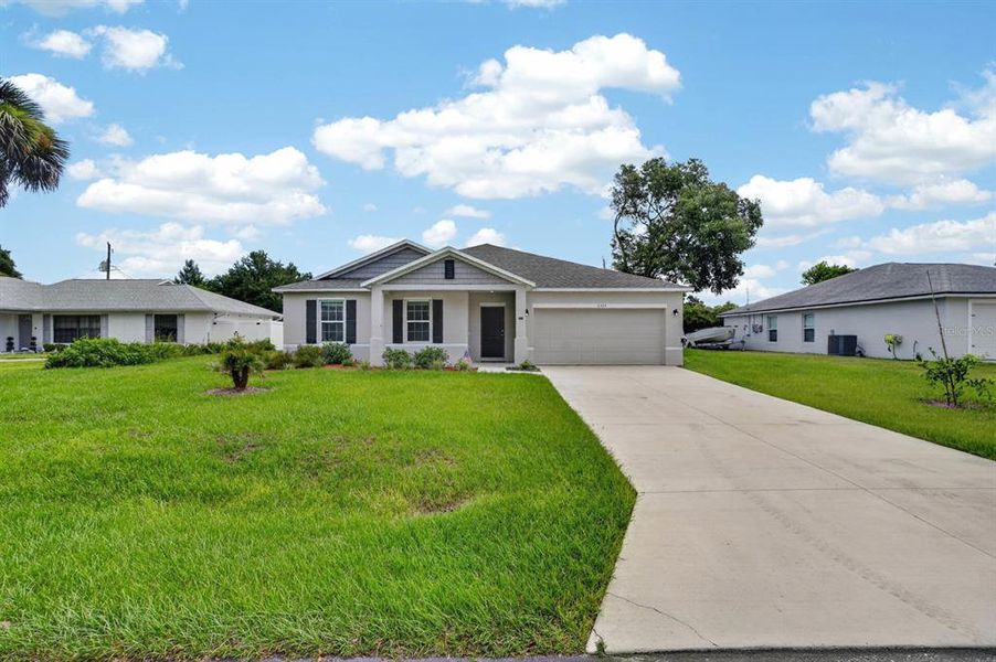Front exterior of a new home in , Edgewater, FL, highlighting curb appeal (Image 21). Front exterior of a new home in , Edgewater, FL, highlighting curb appeal (Image 21).