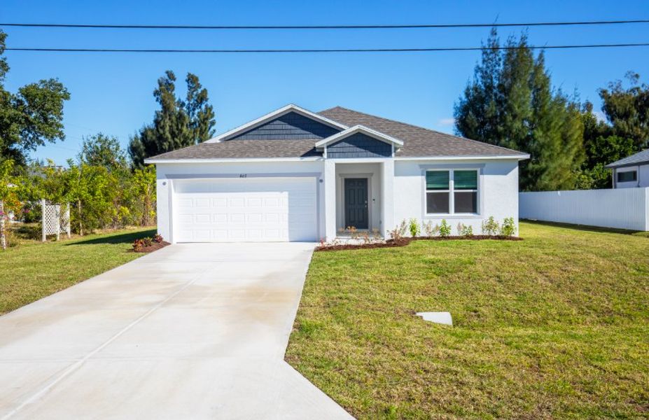 Front exterior of a new home in Cape Coral, Cape Coral, FL, highlighting curb appeal (Image 1). Front exterior of a new home in Cape Coral, Cape Coral, FL, highlighting curb appeal (Image 1).