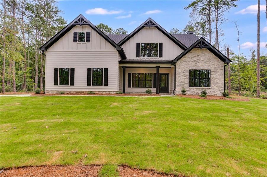 Front exterior of a new home in Liberty Station, Bremen, GA, highlighting curb appeal (Image 27).