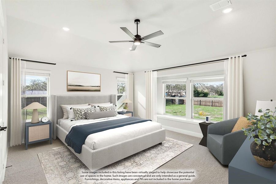 Bright master bedroom with king bed, ceiling fan, carpet flooring, and large windows overlooking a backyard Bright master bedroom with king bed, ceiling fan, carpet flooring, and large windows overlooking a backyard