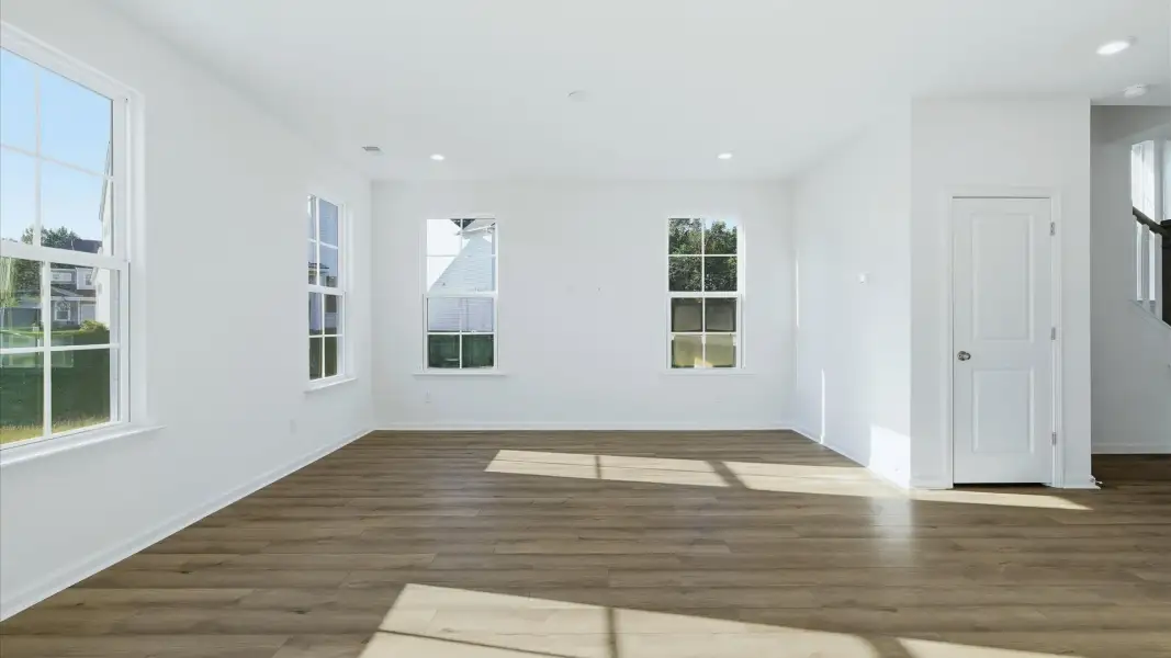 Comfortable living room filled with bright windows