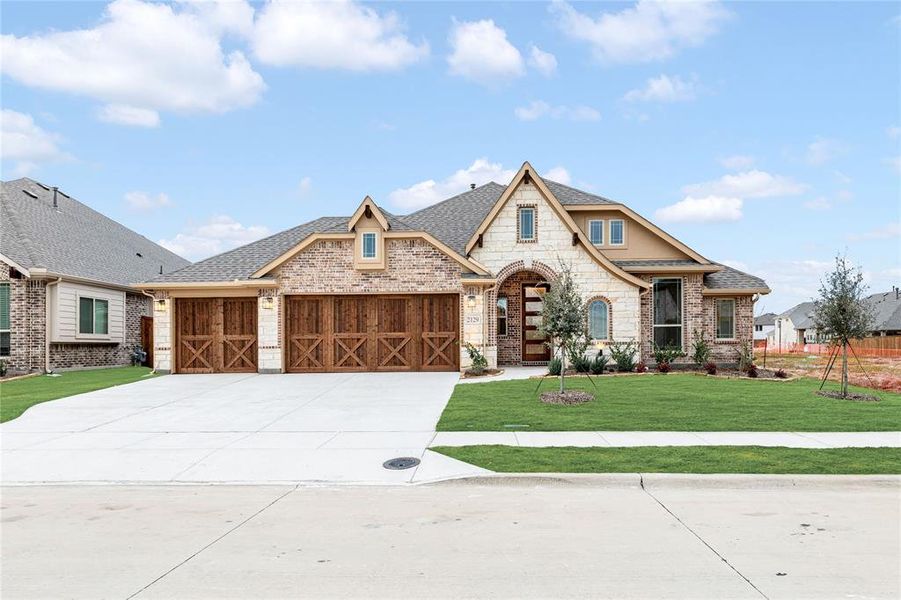 Front exterior of a new home in Stone River Glen 60s, Royse City, TX, highlighting curb appeal (Image 2).