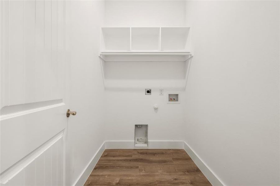 Washroom featuring washer hookup, dark hardwood / wood-style floors, gas dryer hookup, and electric dryer hookup