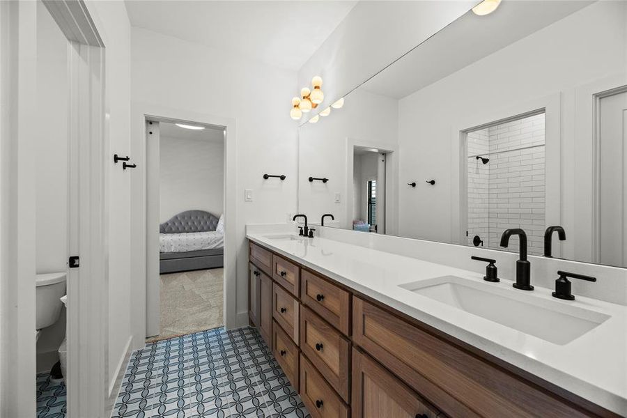 The Hollywood bath offers tons of storage space and dual vanities.