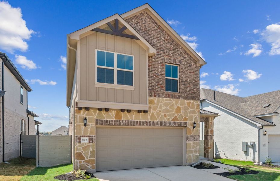 Front exterior of a new home in Wolf Ranch, Georgetown, TX, highlighting curb appeal (Image 19).