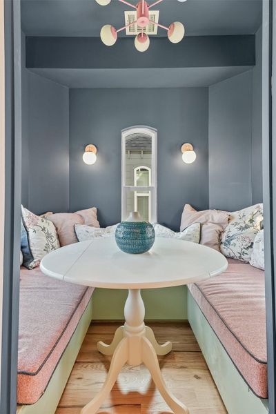 dining space with custom cushions, so that you can roll out the dining table when you wish to roll in the ottoman from the living room. This create a fun queen size space to hangout or sleep.