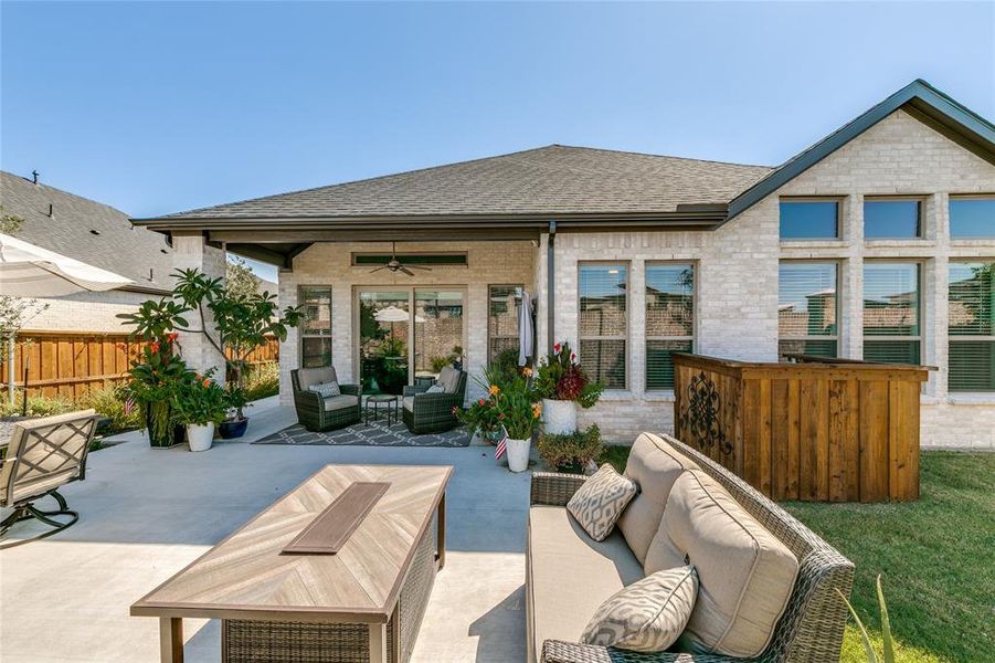 Back of house featuring an outdoor hangout area, ceiling fan, and a patio