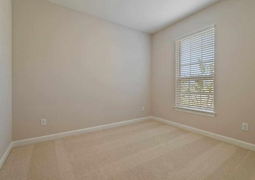 Secondary bedroom with lush carpet flooring Secondary bedroom with lush carpet flooring