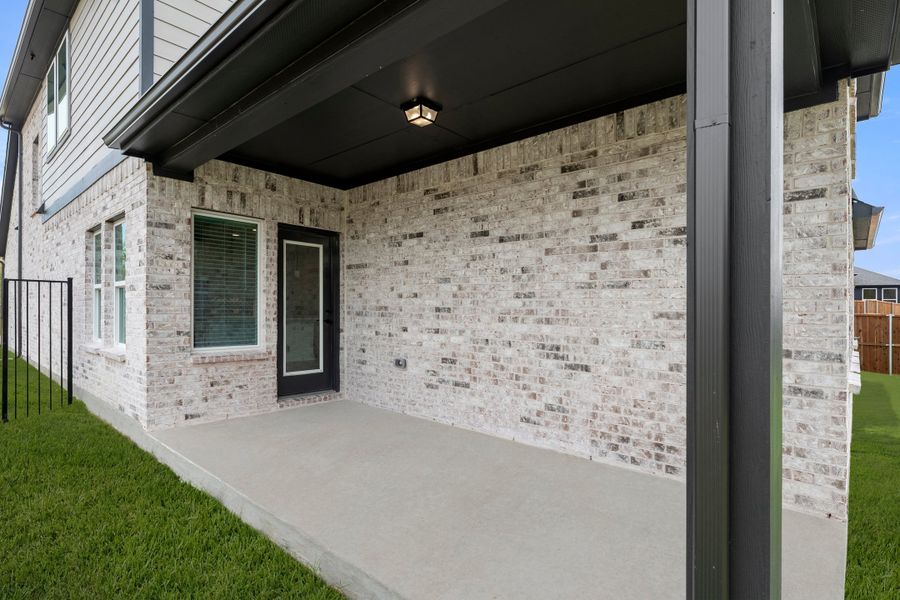 Exterior details and patio area of a home in Creekside, Royse City (Image 2). Exterior details and patio area of a home in Creekside, Royse City (Image 2).