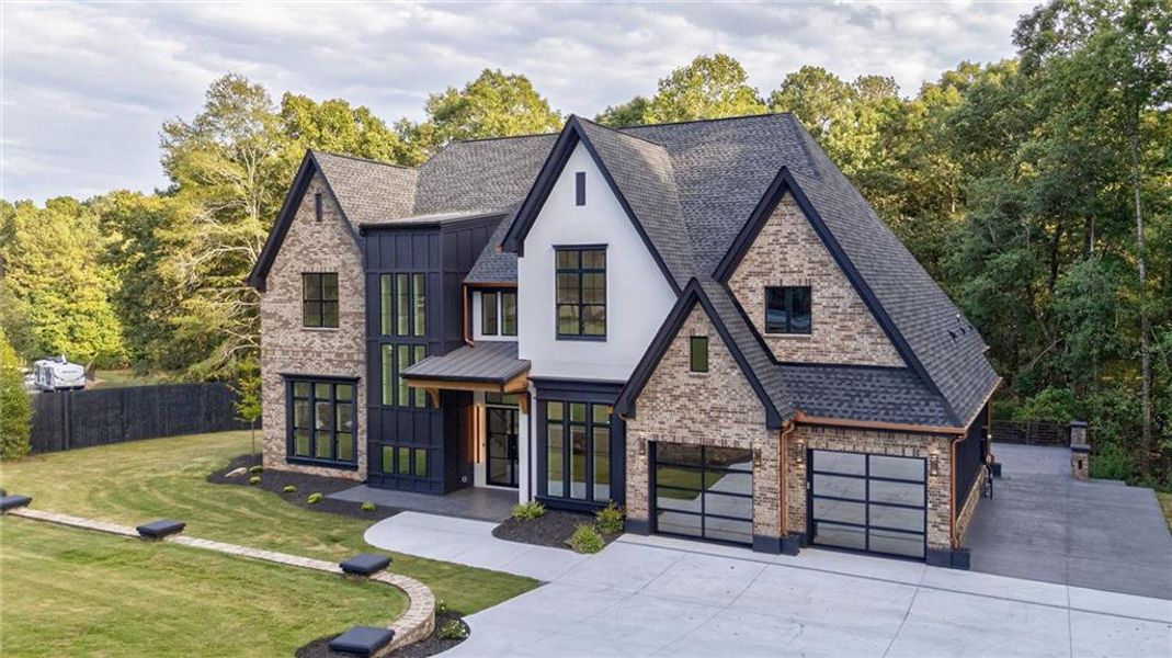Front exterior of a new home in , Loganville, GA, highlighting curb appeal (Image 39). Front exterior of a new home in , Loganville, GA, highlighting curb appeal (Image 39).