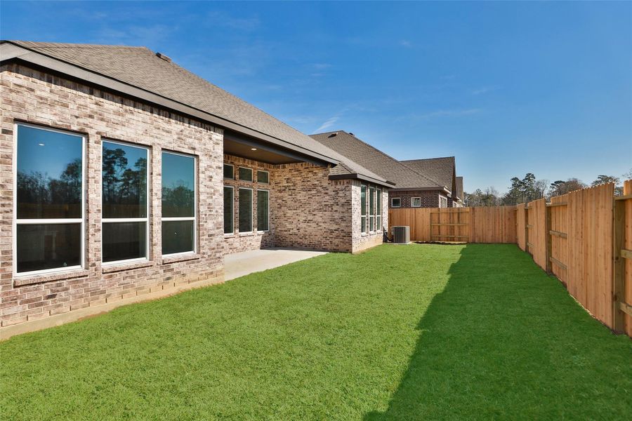 Exterior details and patio area of a home in Sundance Cove, Crosby (Image 3).