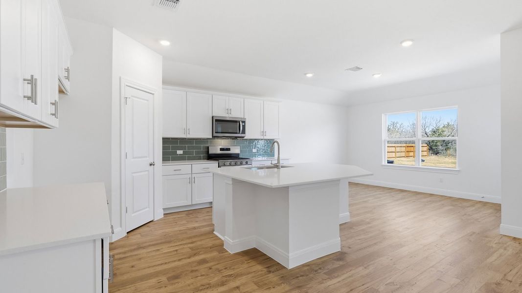 Furnished interior view inside a new home in Railhead, Cedar Creek (Image 6).