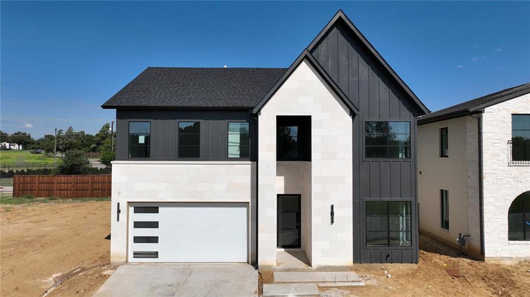 Front exterior of a home in the Dove Station Luxury Series community, located in Grapevine, TX (Image 1). Front exterior of a home in the Dove Station Luxury Series community, located in Grapevine, TX (Image 1).