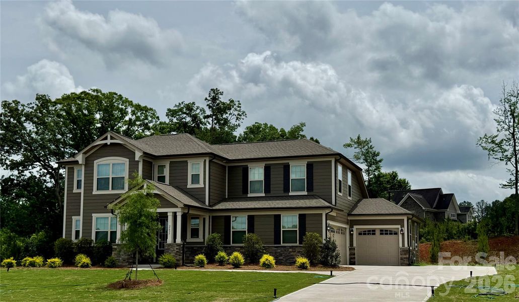 Front exterior of a new home in Blair Place, Monroe, NC, highlighting curb appeal (Image 5). Front exterior of a new home in Blair Place, Monroe, NC, highlighting curb appeal (Image 5).