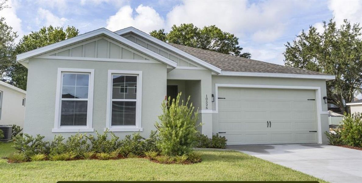 Front exterior of a new home in Estes Reserve, Eustis, FL, highlighting curb appeal (Image 2).