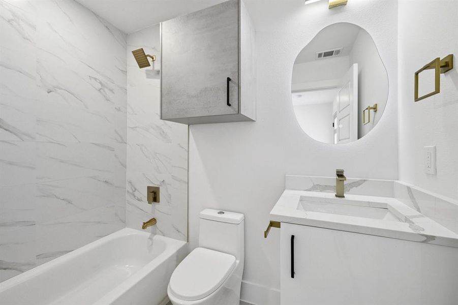 Bathroom with vanity and shower / bathtub combination