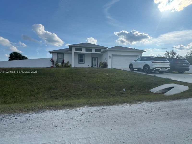 Front exterior of a new home in , Labelle, FL, highlighting curb appeal (Image 6).