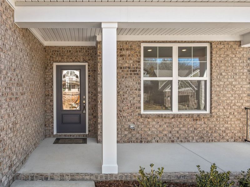 Exterior details and patio area of a home in Woods Crossing, Gallatin (Image 3).