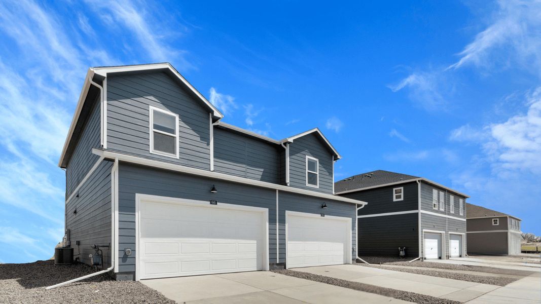 Front exterior of a new home in Vista Meadows, Fort Lupton, CO, highlighting curb appeal (Image 2).