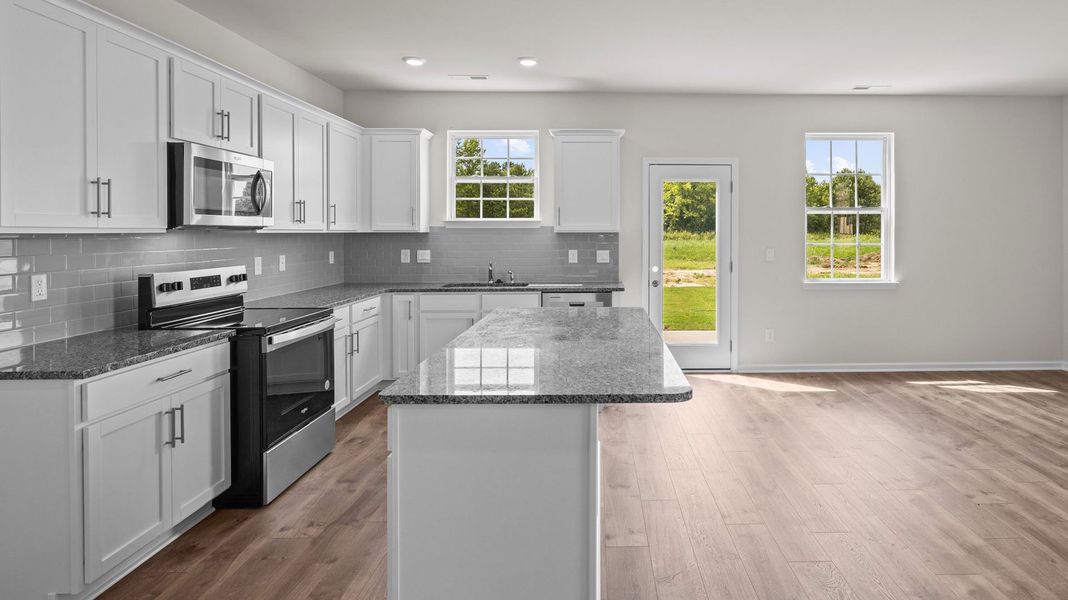 Furnished interior view inside a new home in The Preserve at Kinsley, Jamestown (Image 3).