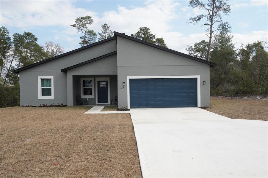 Front exterior of a new home in , Ocala, FL, highlighting curb appeal (Image 28).