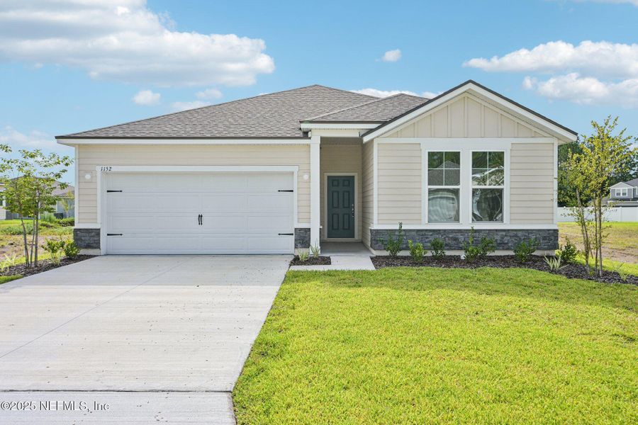 Front exterior of a new home in Panther Creek, Jacksonville, FL, highlighting curb appeal (Image 1). Front exterior of a new home in Panther Creek, Jacksonville, FL, highlighting curb appeal (Image 1).