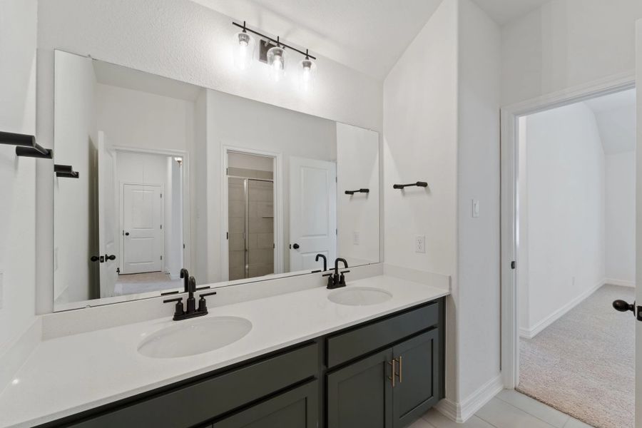 Second bath. Note: Sample product photo. Actual exterior and interior selections may vary by homesite. Photo may be virtually staged