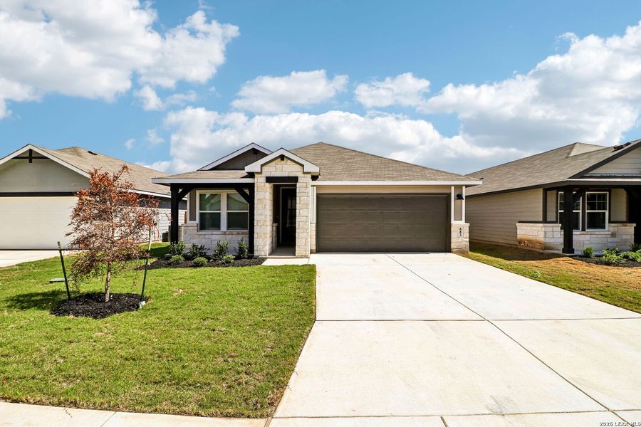 Front exterior of a new home in Estancia Ranch - Premier Series, San Antonio, TX, highlighting curb appeal (Image 27). Front exterior of a new home in Estancia Ranch - Premier Series, San Antonio, TX, highlighting curb appeal (Image 27).