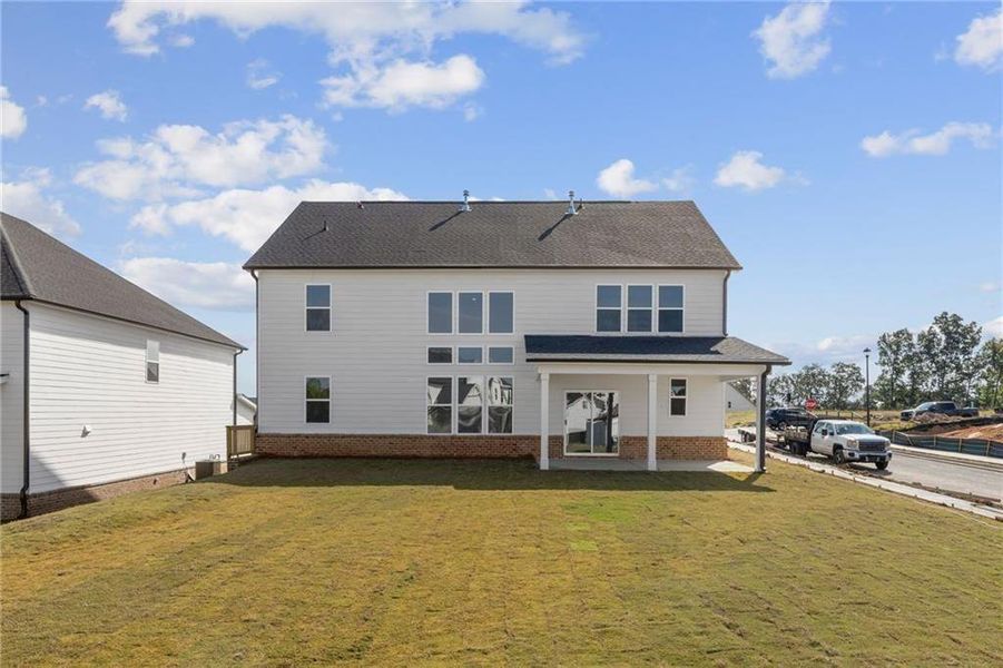Exterior details and patio area of a home in The Estates at Gainesville Township, Gainesville (Image 4).