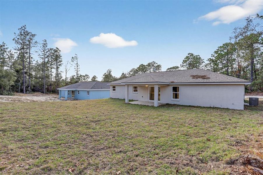 Exterior details and patio area of a home in , Citrus Springs (Image 25).