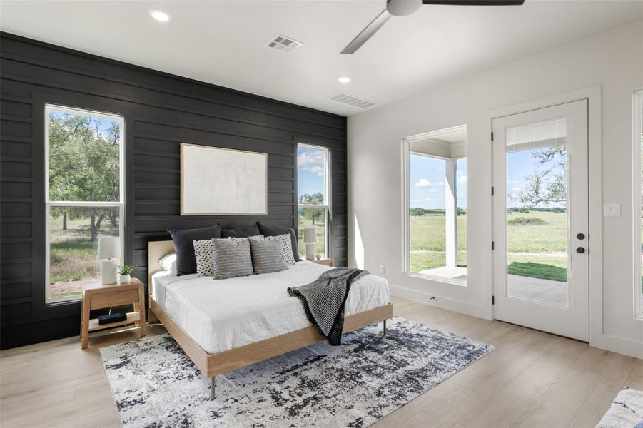 Bedroom featuring view of pond Bedroom featuring view of pond