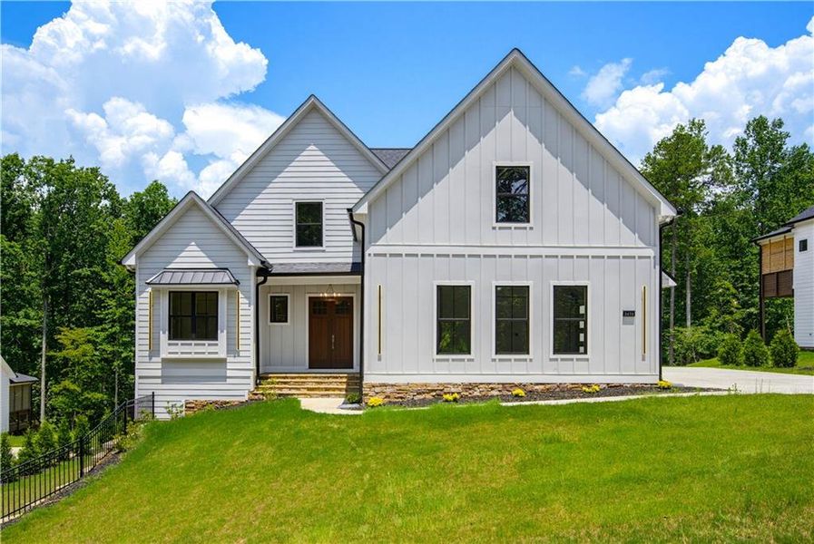 Front exterior of a new home in , Cumming, GA, highlighting curb appeal (Image 2).