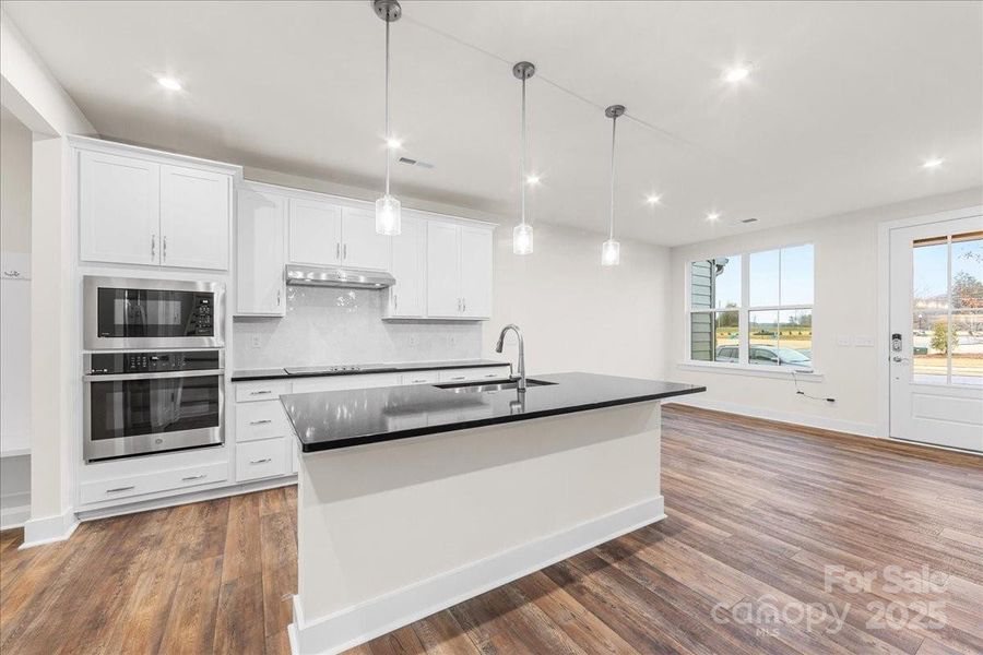 Modern White Cabinetry Paired with Premium Chrome Hardware.