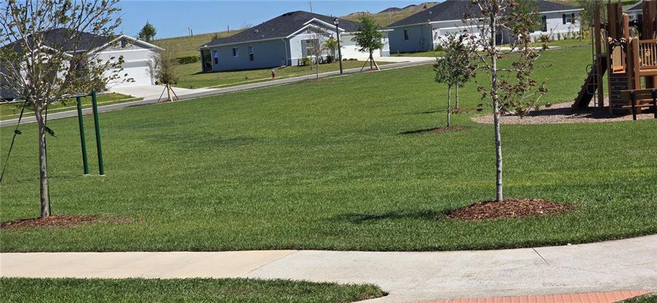 Front exterior of a new home in , Mascotte, FL, highlighting curb appeal (Image 1). Front exterior of a new home in , Mascotte, FL, highlighting curb appeal (Image 1).