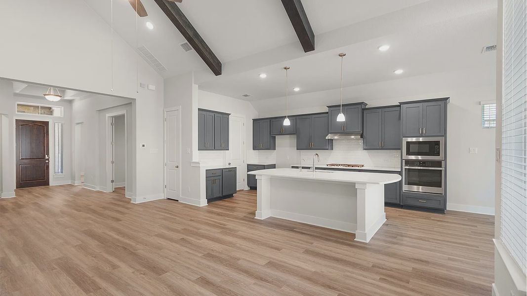 Representative furnished interior of a home built from the Brenner by Chesmar Homes in Newhaven, Manor (Image 8).