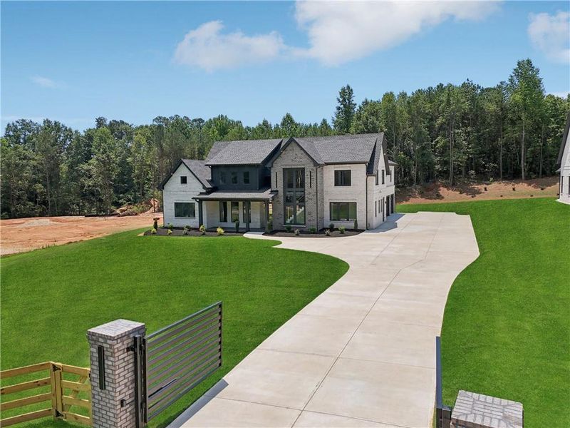 Front exterior of a new home in , Braselton, GA, highlighting curb appeal (Image 53).