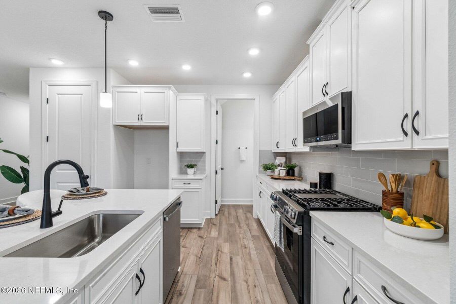 Furnished interior view inside a new home in Westerly Park at Wildlight - Courtyard Collection, Yulee (Image 6).