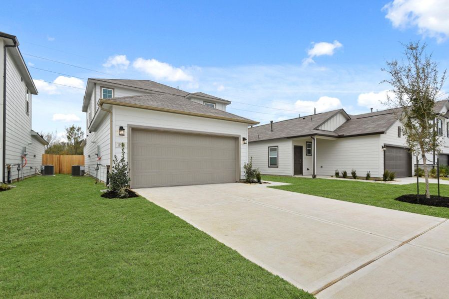 Front exterior of a new home in Barrett Crossing, Crosby, TX, highlighting curb appeal (Image 17).
