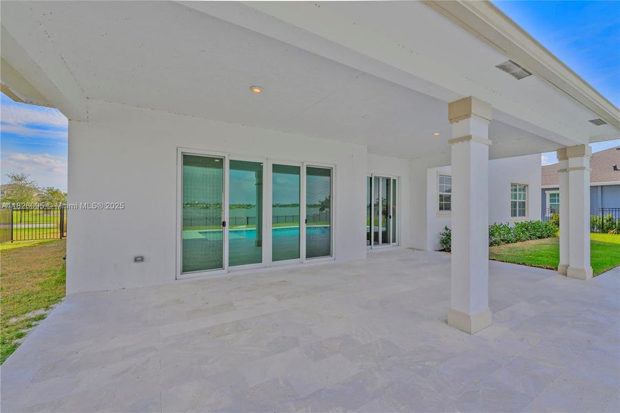 Exterior details and patio area of a home in Arden: The Waterford Collection, Loxahatchee (Image 3).