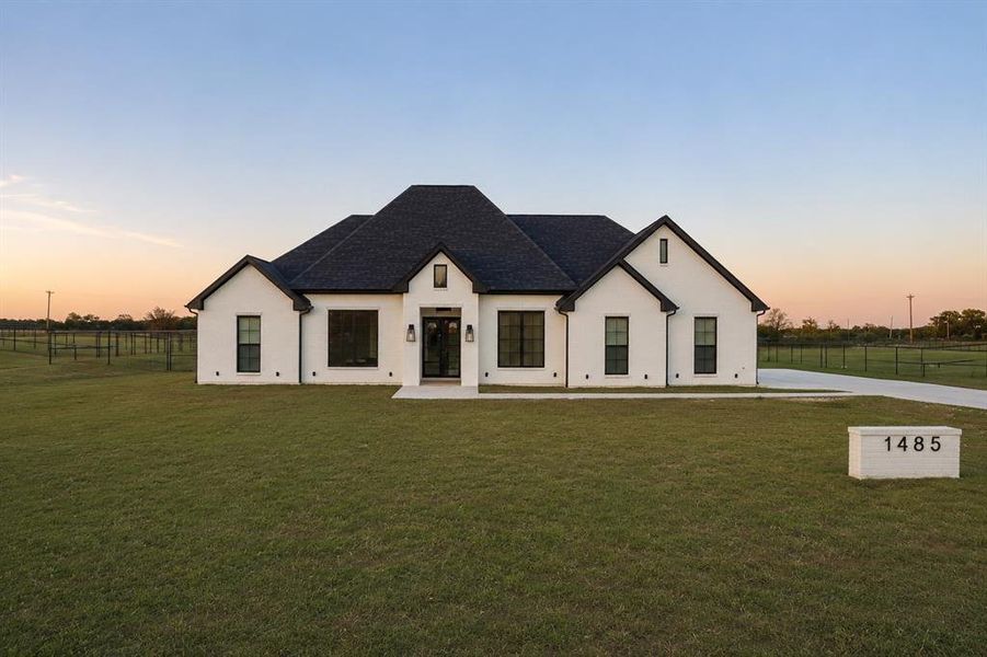 Front exterior of a new home in , Whitesboro, TX, highlighting curb appeal (Image 1). Front exterior of a new home in , Whitesboro, TX, highlighting curb appeal (Image 1).
