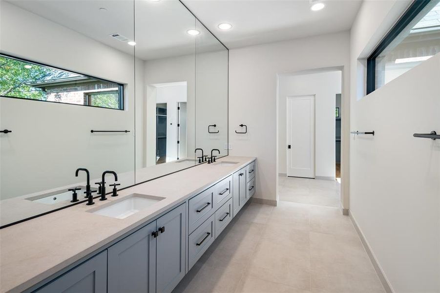 Bathroom with tile patterned flooring and vanity