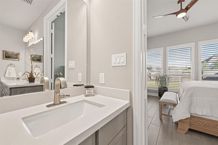 Double vanities accented with premium designer hardware. (Note: Photo is staged; property is currently vacant.) Double vanities accented with premium designer hardware. (Note: Photo is staged; property is currently vacant.)
