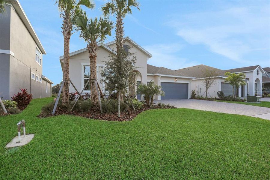 Front exterior of a new home in Seaire, Parrish, FL, highlighting curb appeal (Image 24).