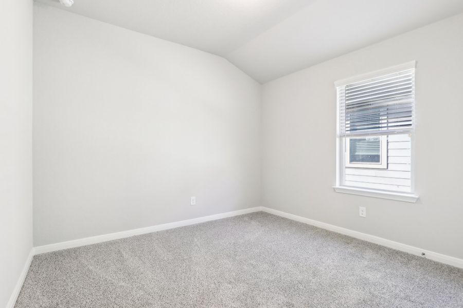 Guest bedroom in the Oleander floorplan at a Meritage Homes community. Guest bedroom in the Oleander floorplan at a Meritage Homes community.