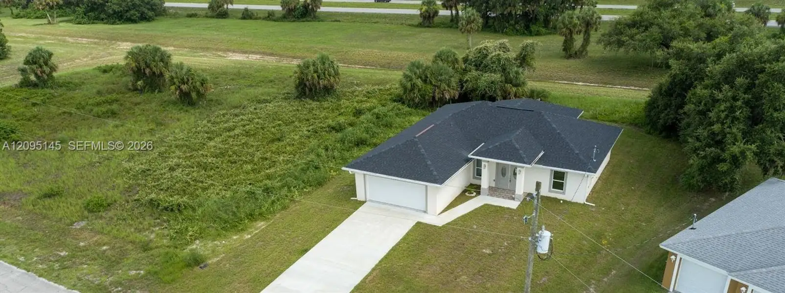 Front exterior of a new home in , Labelle, FL, highlighting curb appeal (Image 24). Front exterior of a new home in , Labelle, FL, highlighting curb appeal (Image 24).
