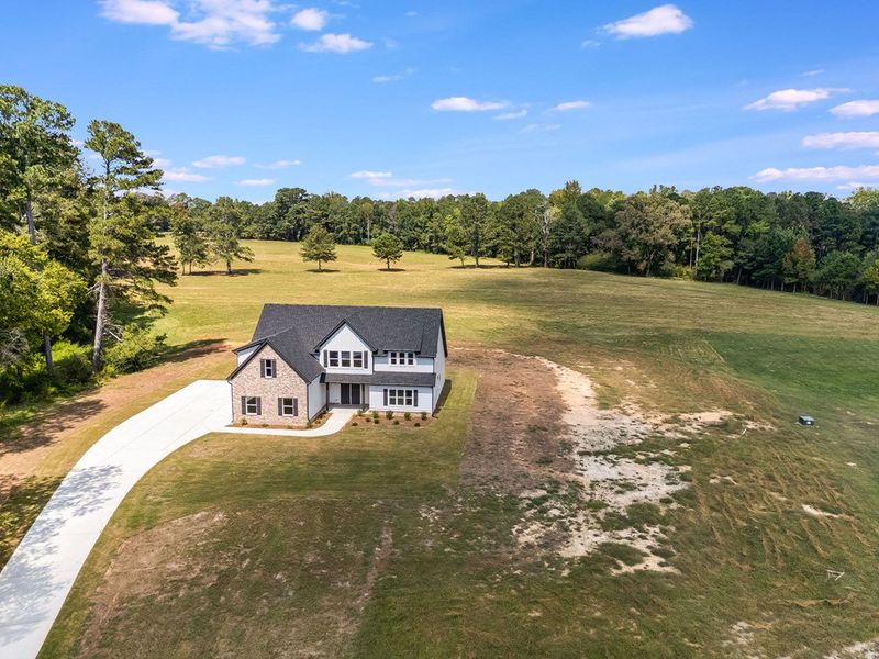 Front exterior of a new home in LOVVORN ESTATES, Carrollton, GA, highlighting curb appeal (Image 25).